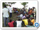 Mr. Ejangole, a community leader explaining project activities to a local community