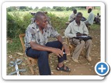 Project leader explaining project activities to Mr. Joseph Omoding the Parish Chief of Obwanai